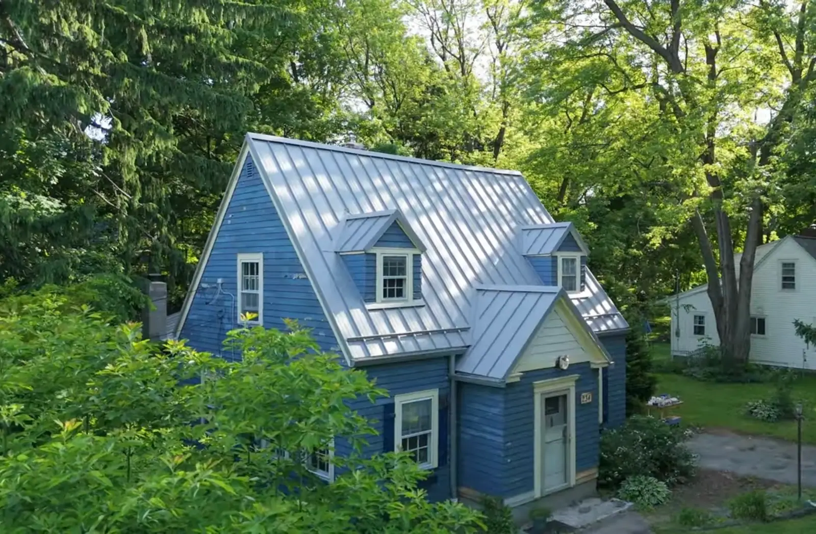 Completed roof replacement on a Rochester, NY home by Tall Pines Roofing