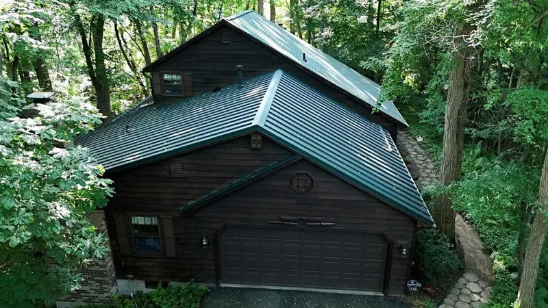 Standing seam metal roof installed by Tall Pines on a Rochester home